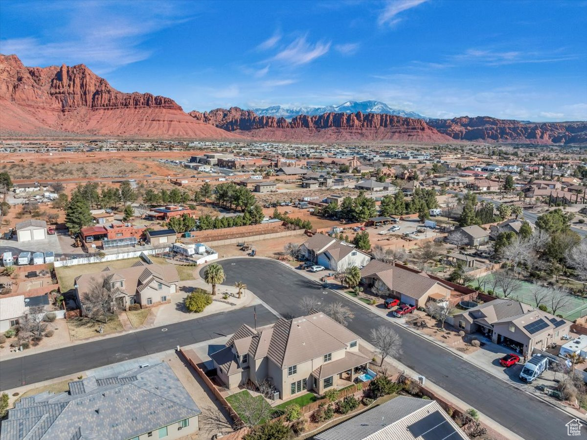 Birds eye view of property with a residential view and a mountain view