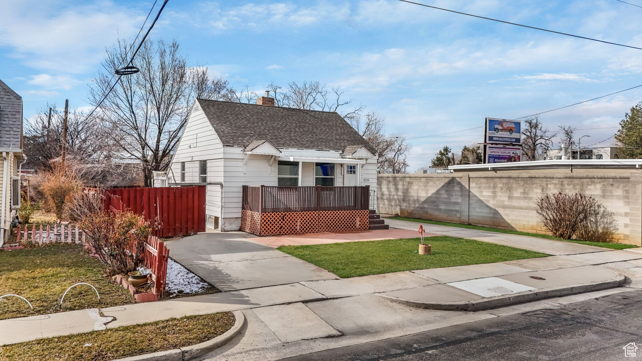 Bungalow-style house featuring a shingled roof, fence private yard, and a chimney