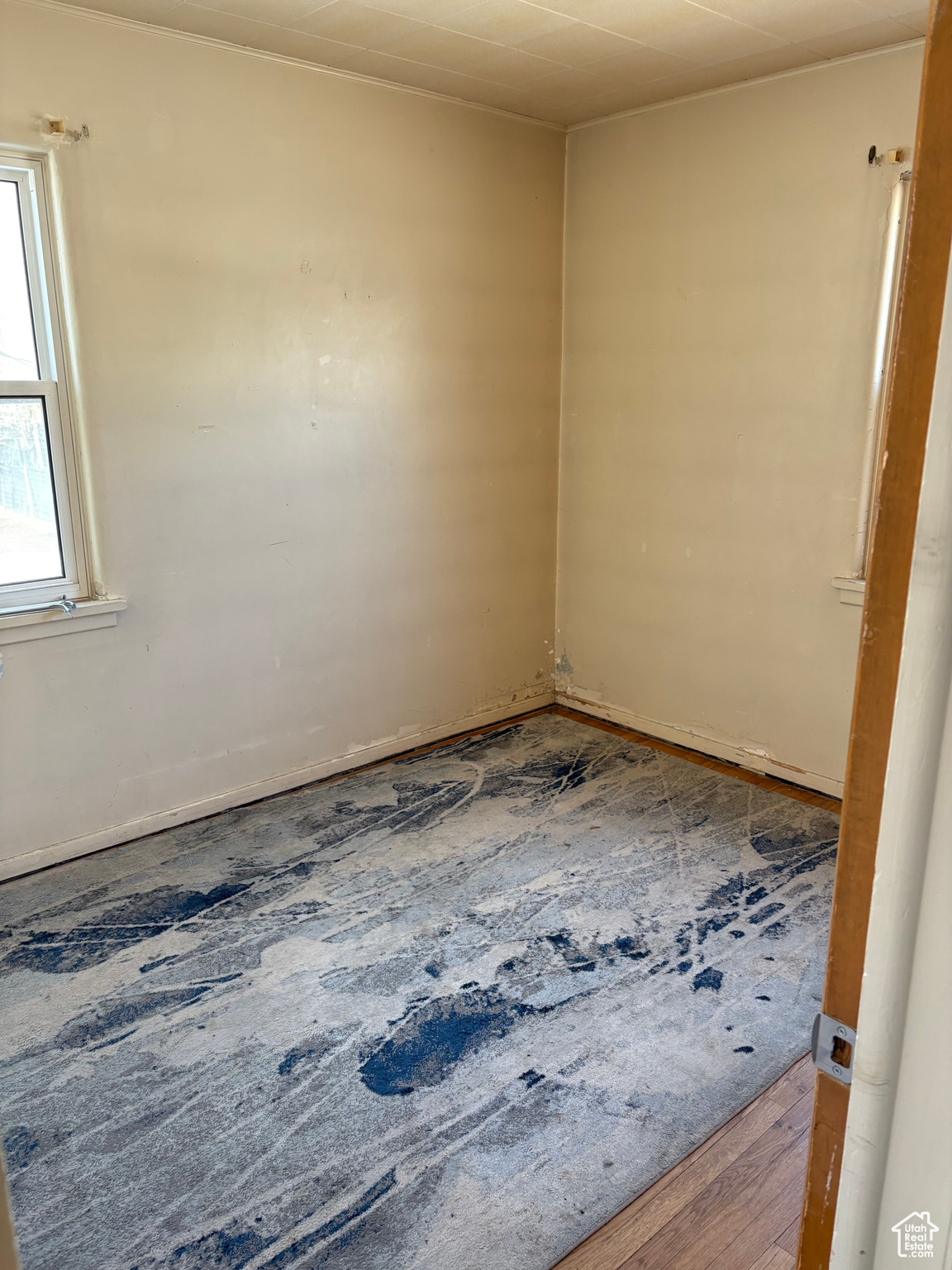 Unfurnished bedroom featuring wood finished floors