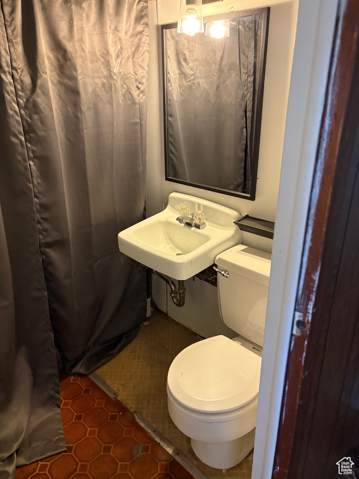 1/2 Basement Bathroom featuring a sink and toilet