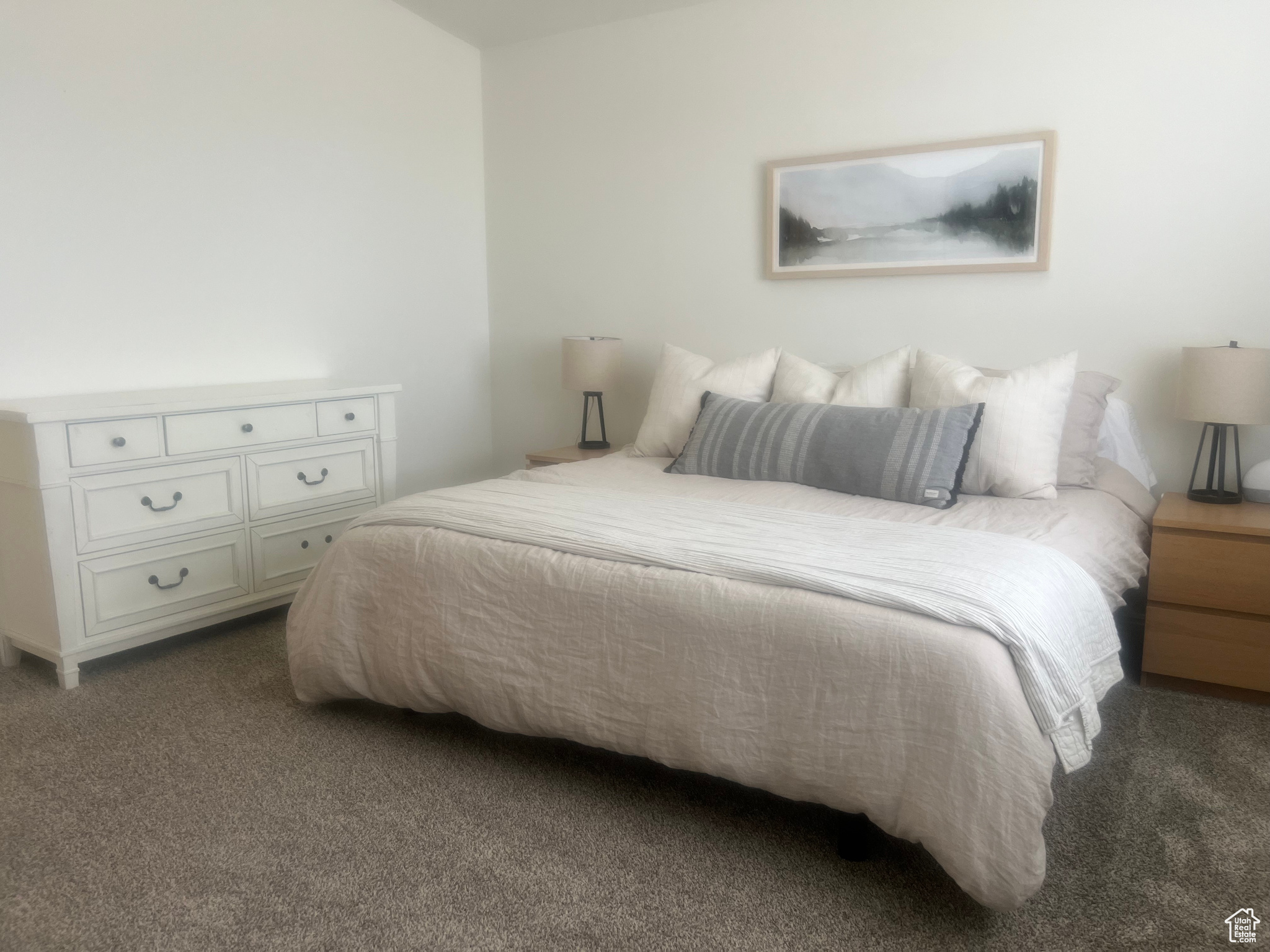 Bedroom with dark colored carpet