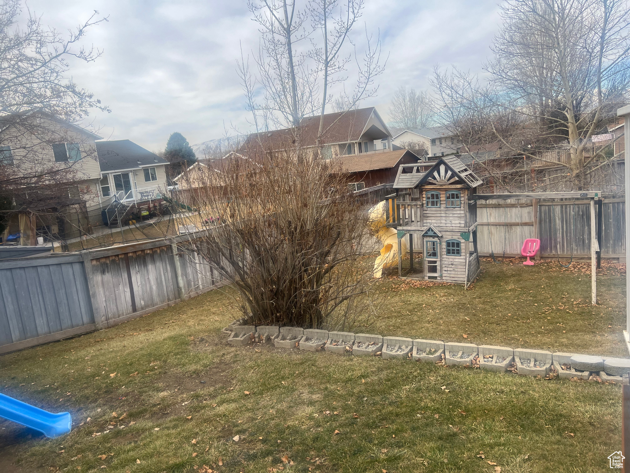 View of yard featuring fence
