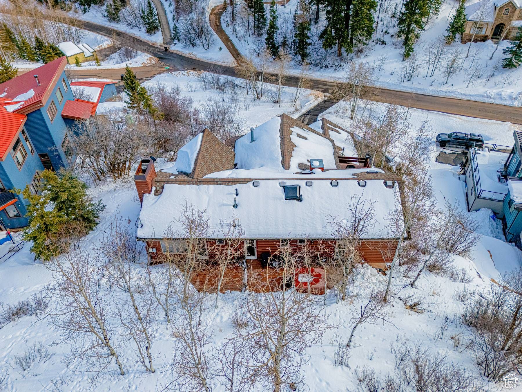 Snowy aerial view featuring a residential view