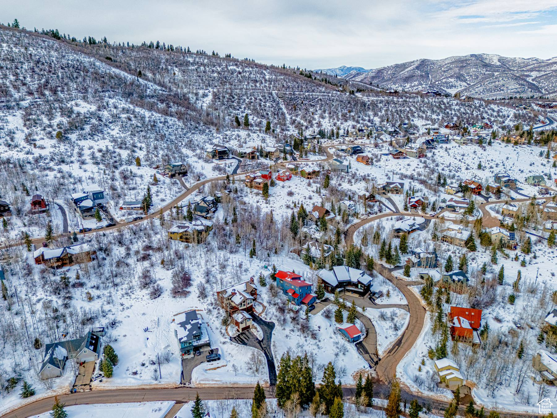 Snowy aerial view with a residential view and a mountain view