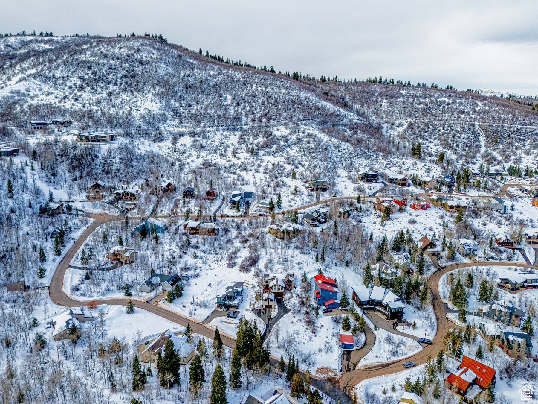 Snowy aerial view with a residential view and a mountain view