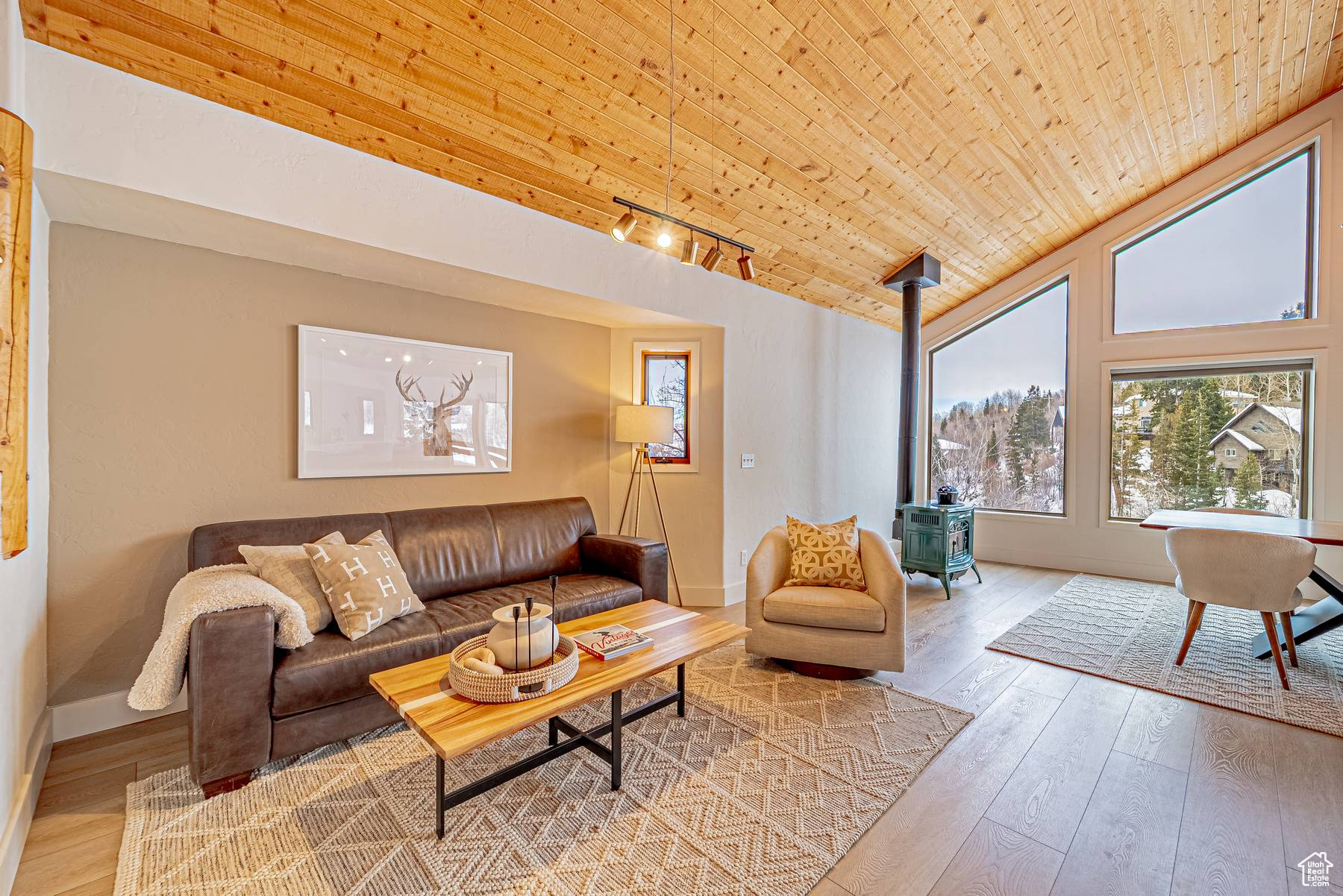 Living room featuring wood ceiling, vaulted ceiling, and wood-type flooring