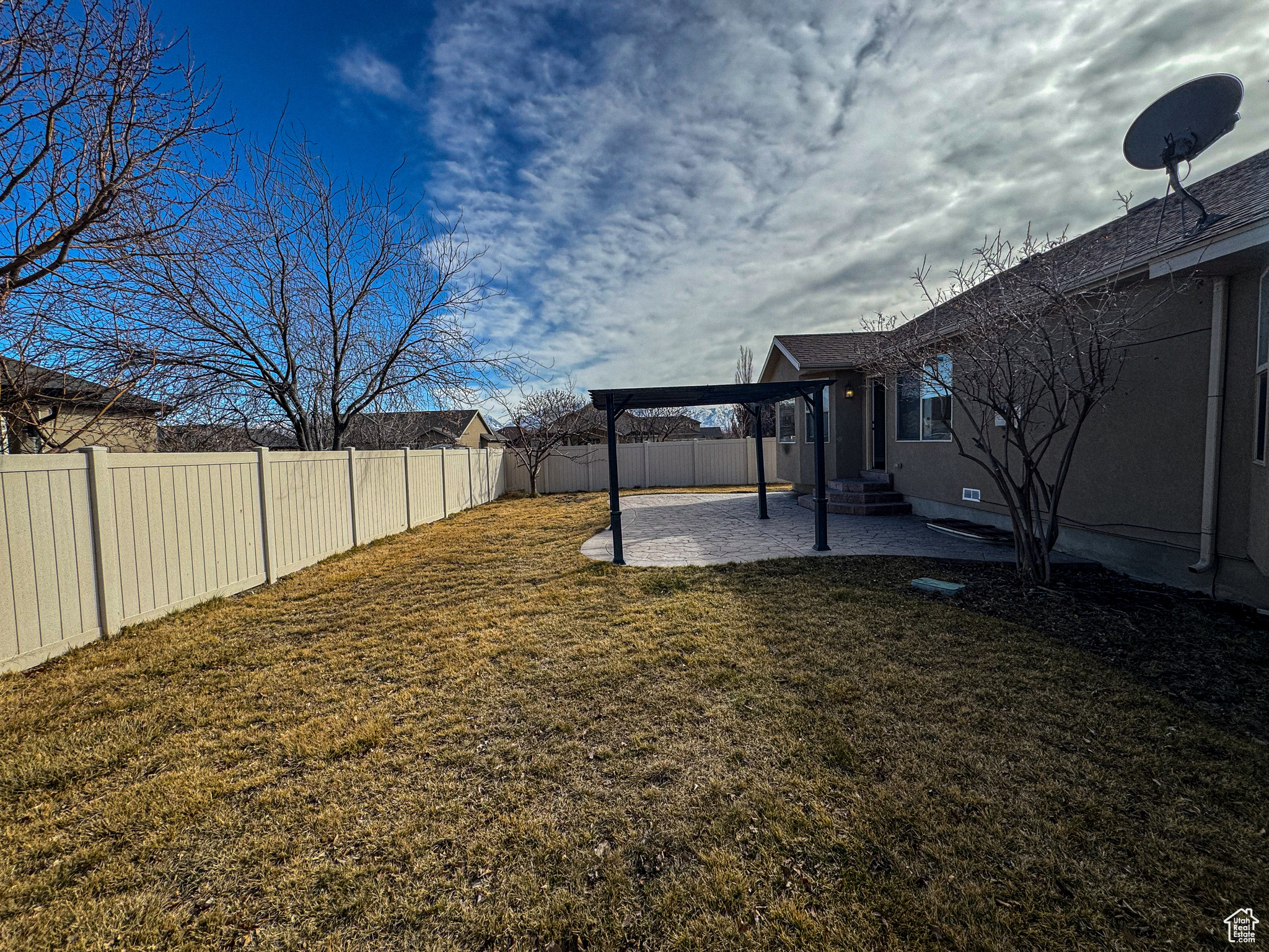 View of yard with a patio area, a fenced backyard, and a pergola