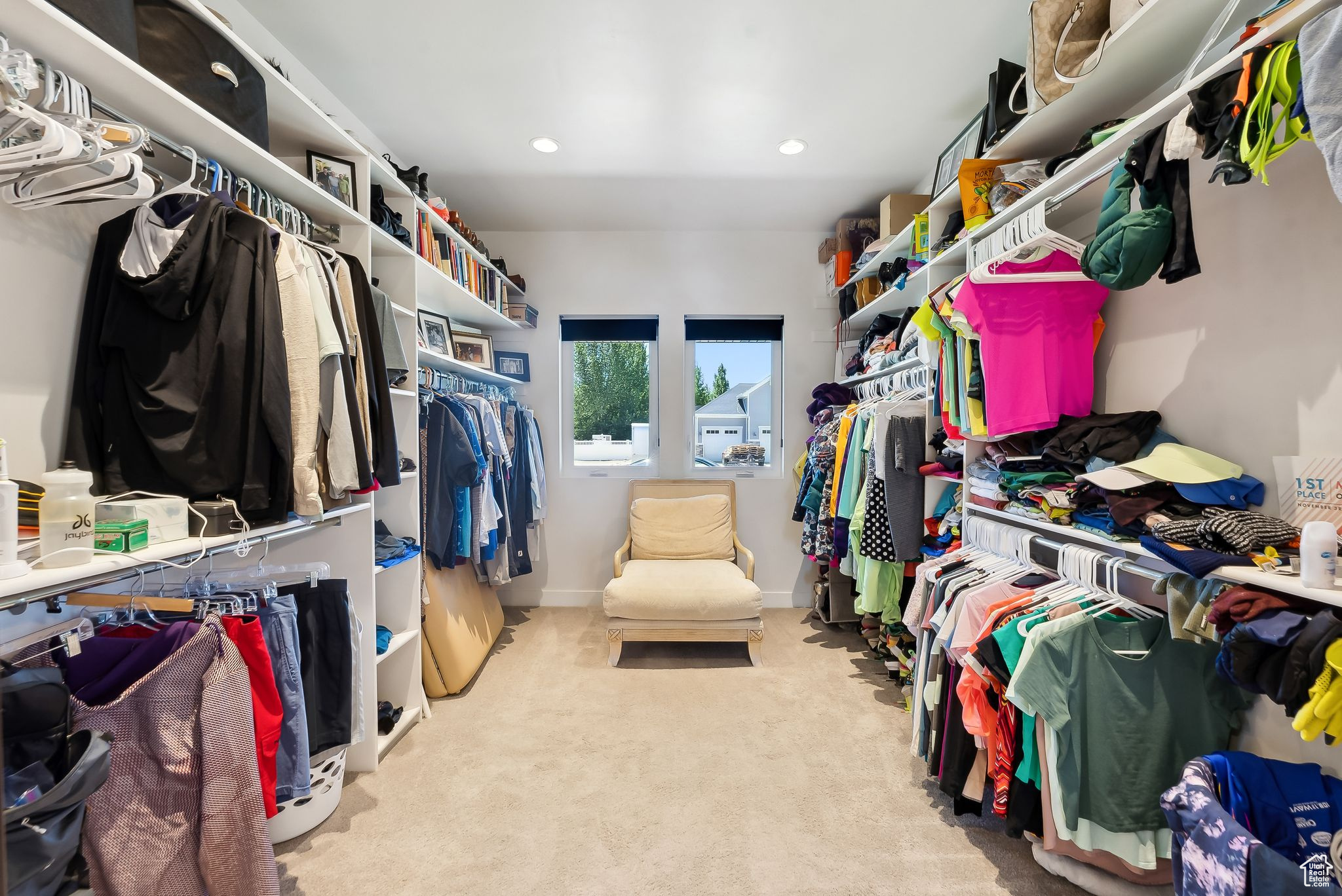 Spacious closet featuring light carpet