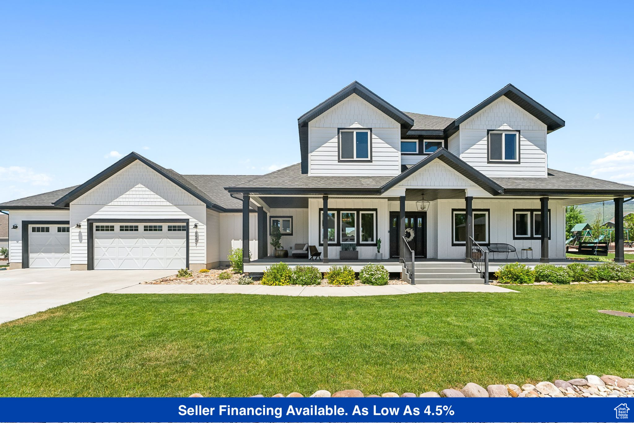 Modern farmhouse style home featuring covered porch, driveway, an attached garage, and a front yard