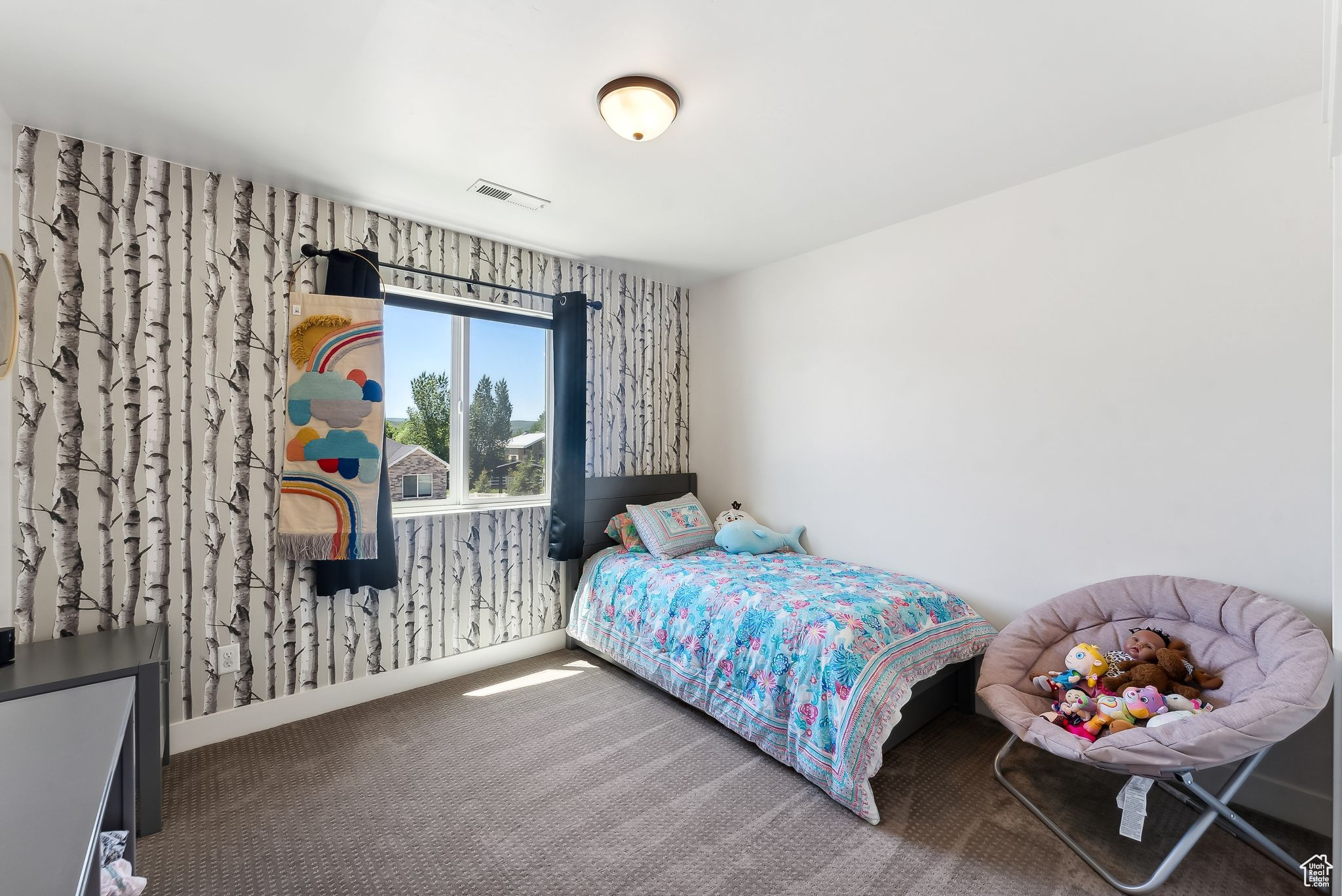 Bedroom featuring carpet floors, visible vents, and baseboards