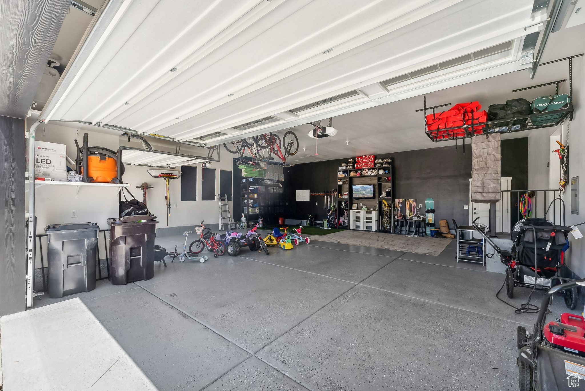 Garage featuring a garage door opener