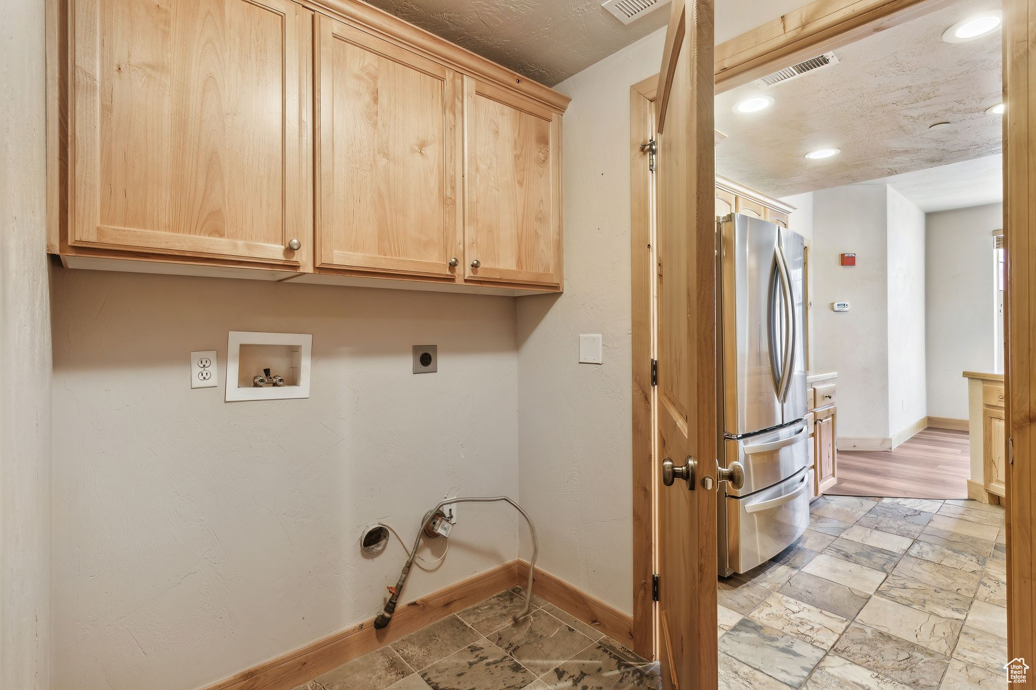 Laundry Room featuring hookup for a gas dryer, cabinet space