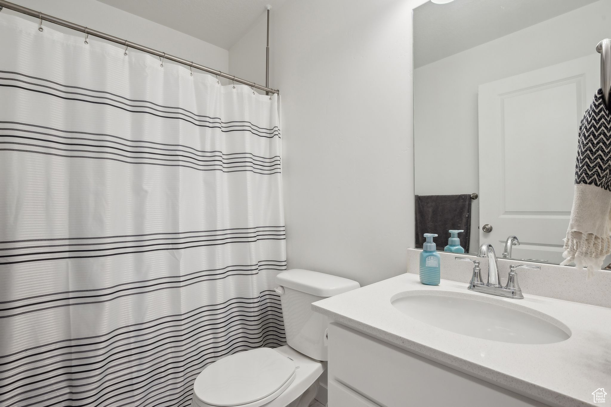 Full bath featuring toilet and vanity