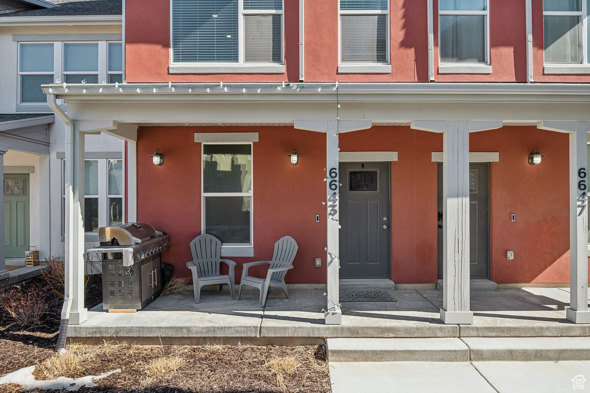 Entrance to property featuring stucco siding