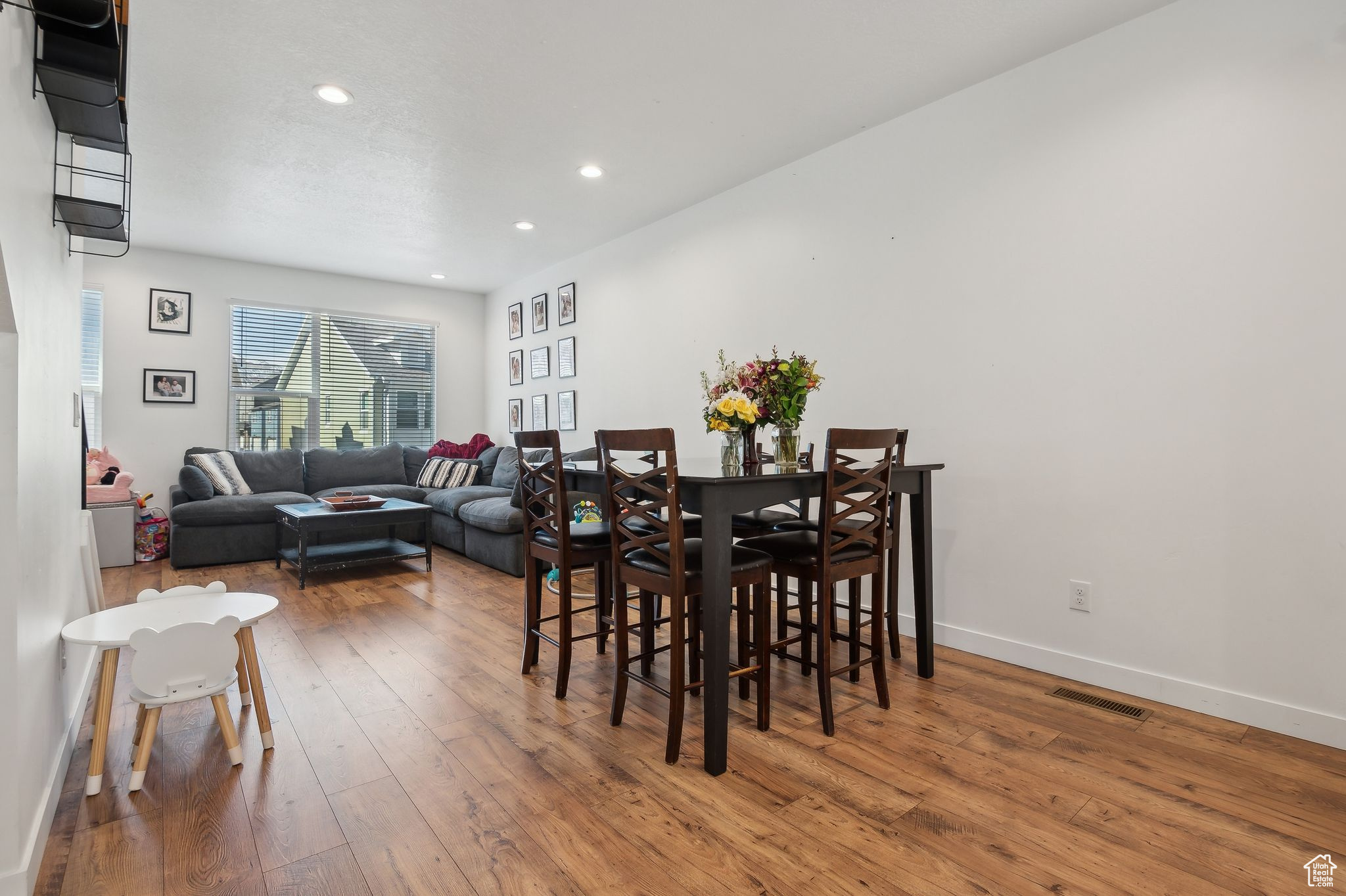 Dining space featuring recessed lighting, wood finished floors, visible vents, and baseboards
