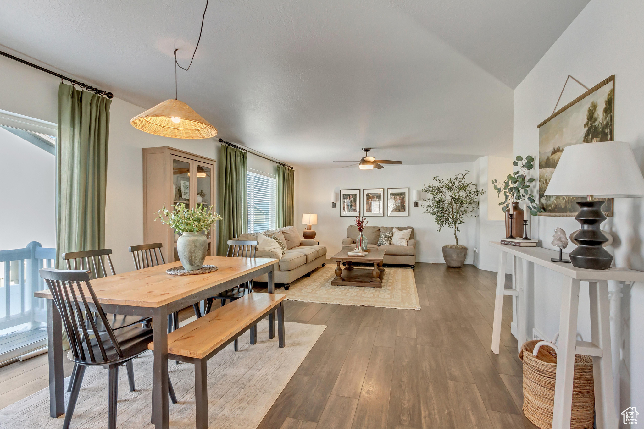 Dining area with ceiling fan and wood finished floors