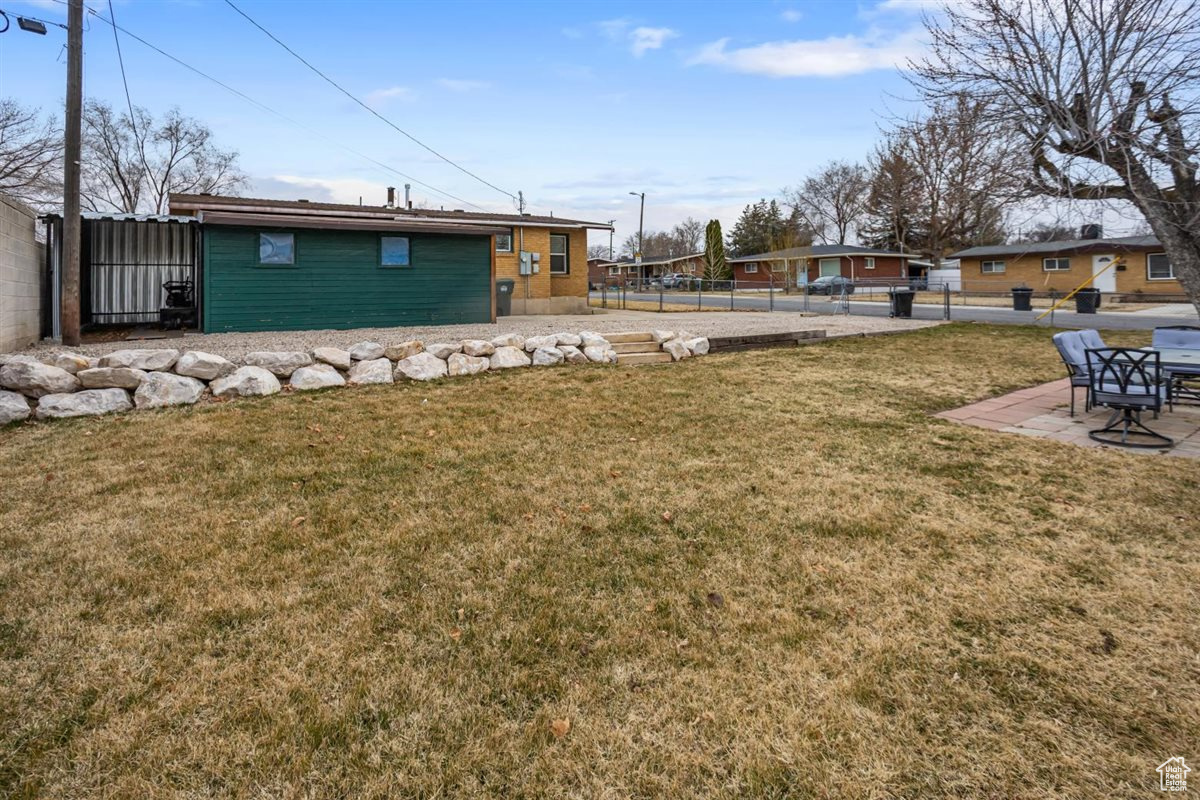 View of yard featuring fence