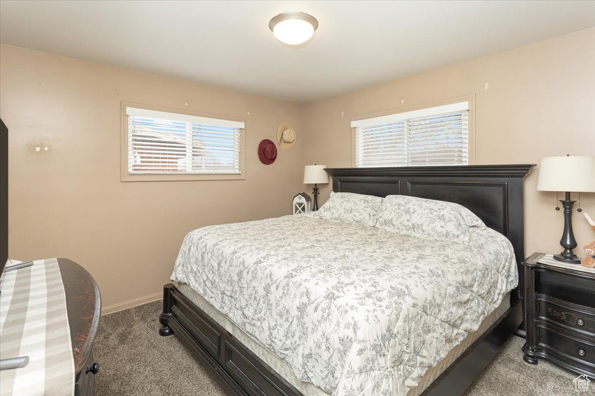 Bedroom with light colored carpet