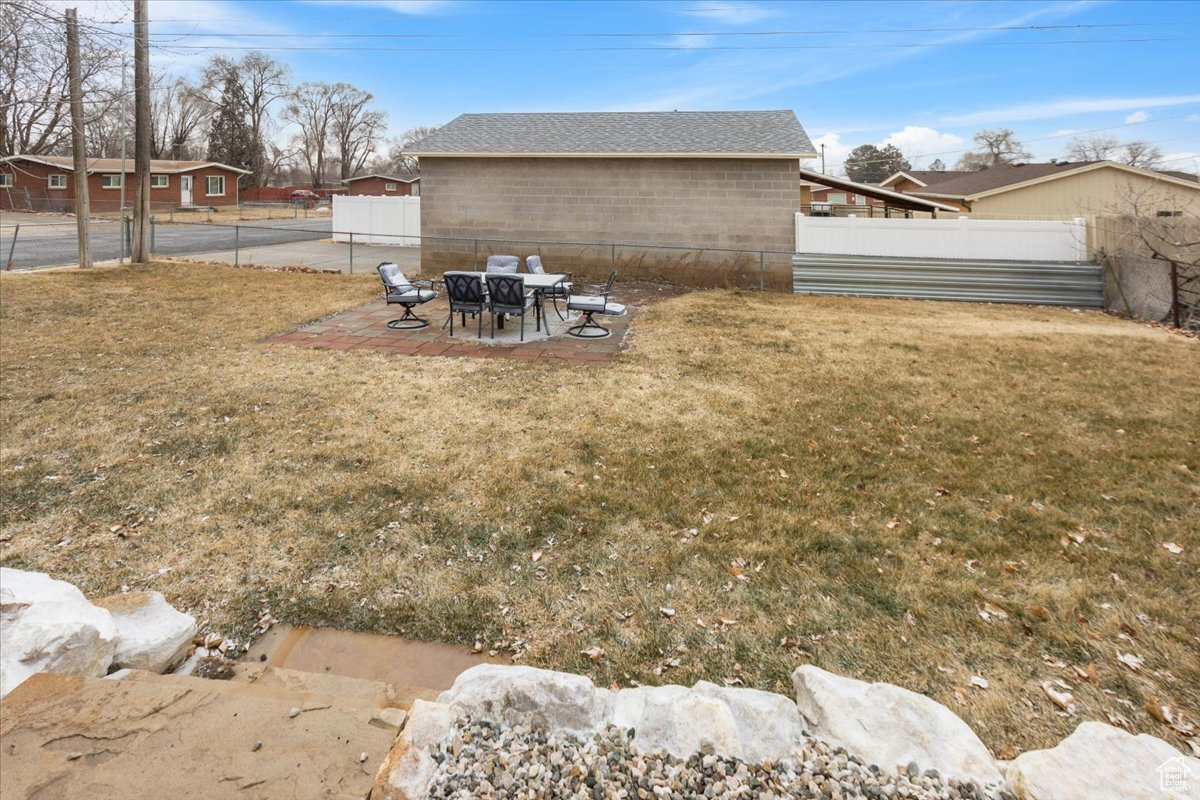 View of yard with a patio