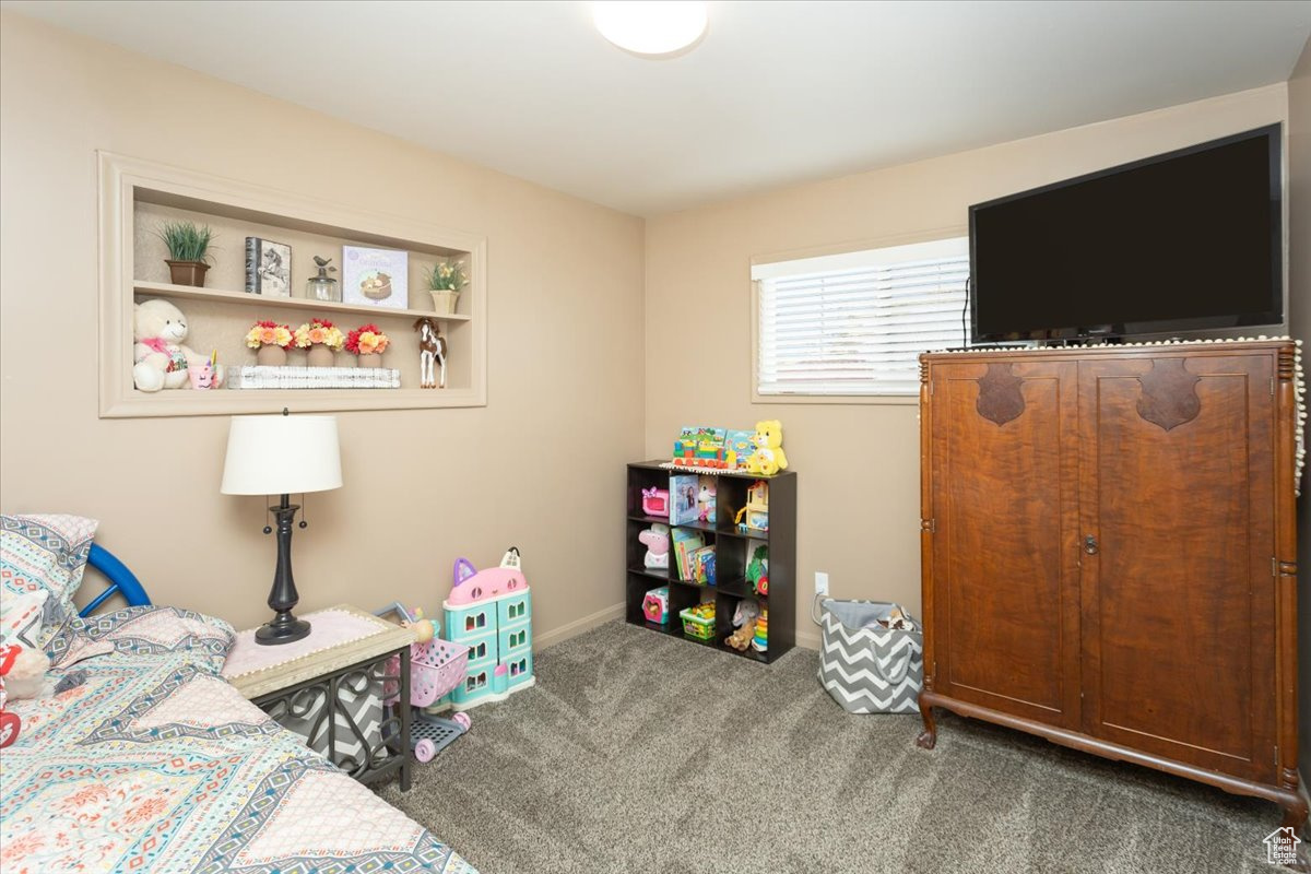 Bedroom with carpet flooring