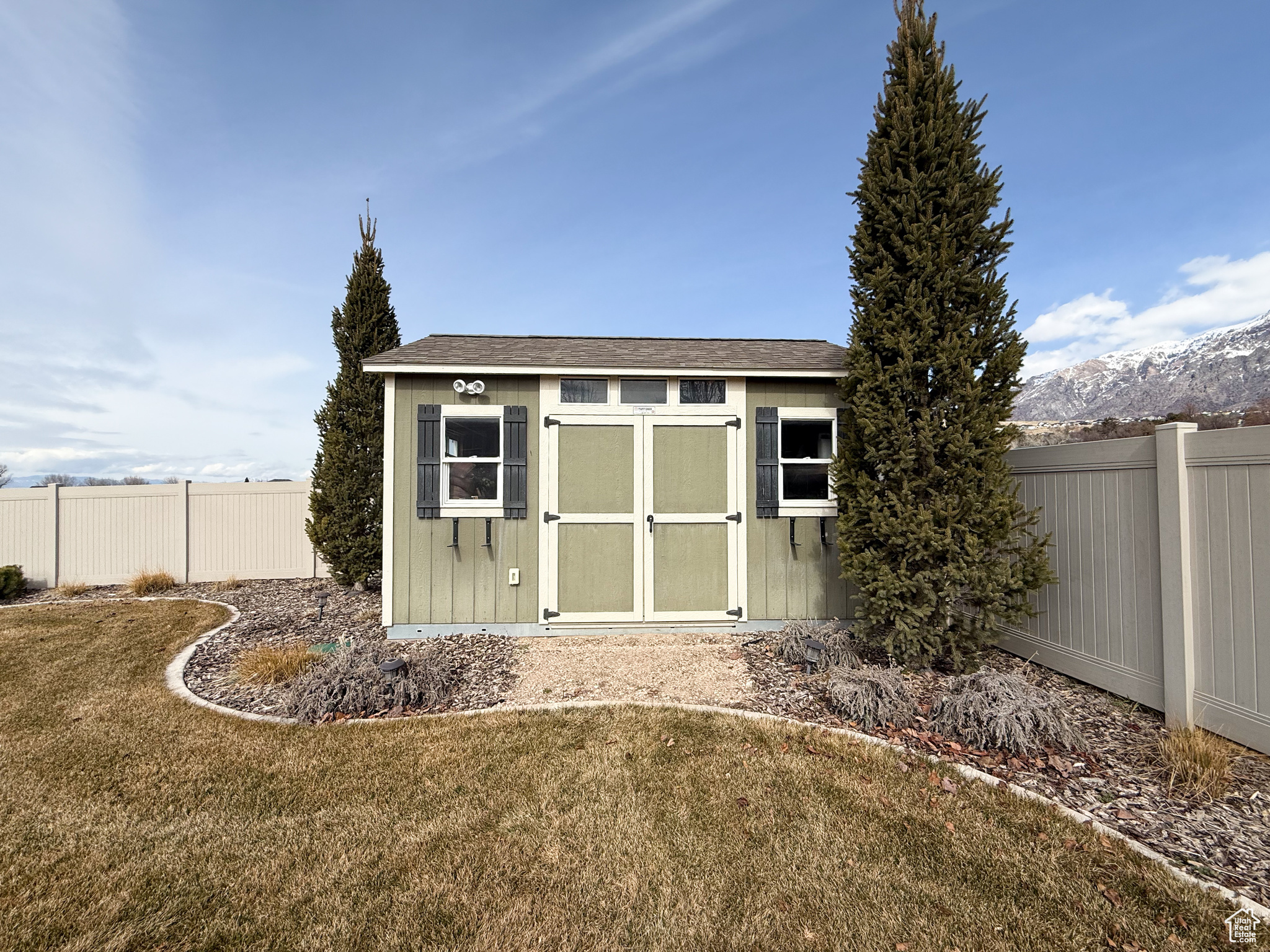 View of shed with fence