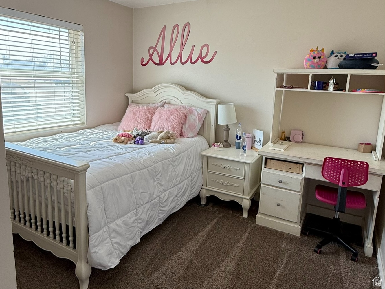 Bedroom with dark colored carpet