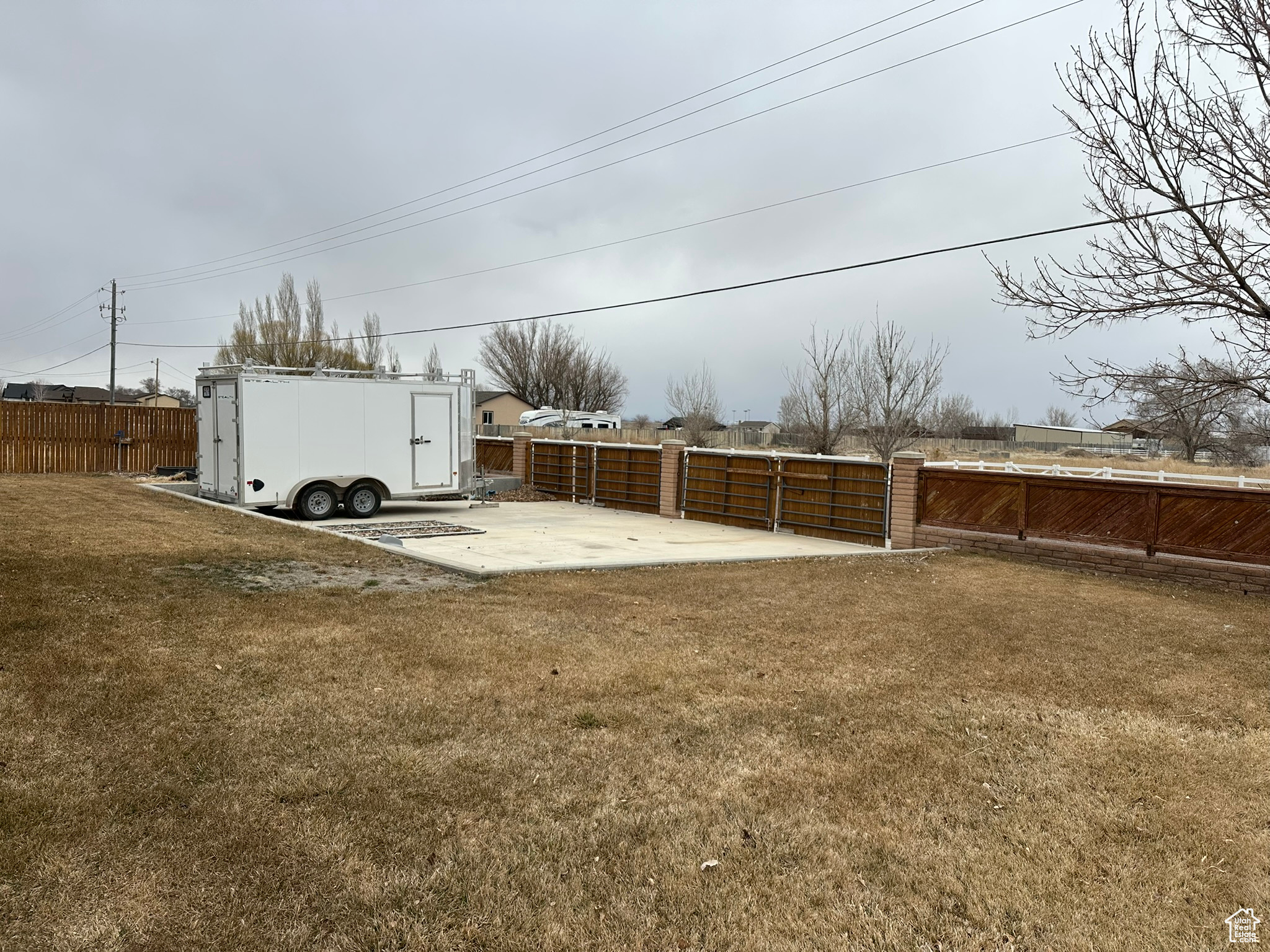 View of yard featuring a patio area and fence