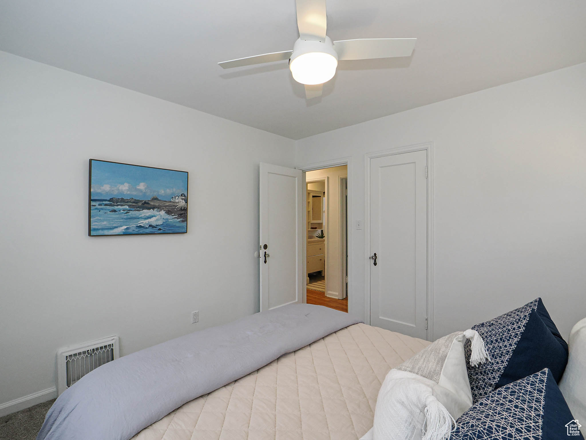 Bedroom featuring visible vents and ceiling fan