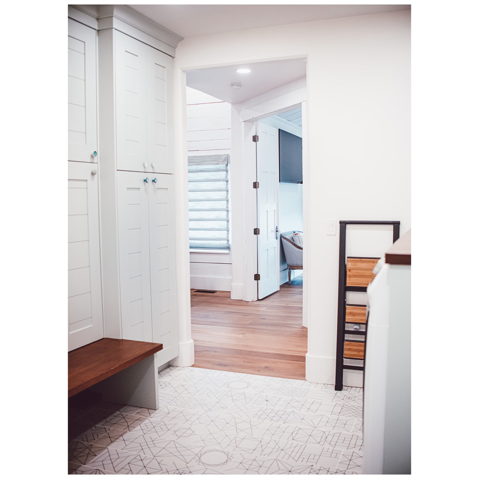 Mudroom with baseboards and wood finished floors