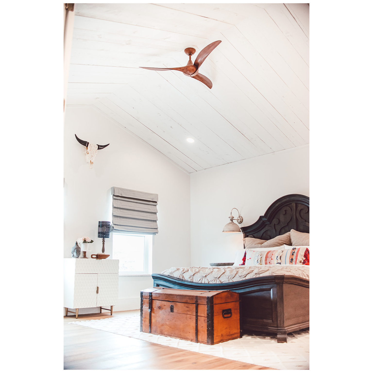 Bedroom featuring lofted ceiling and wood finished floors