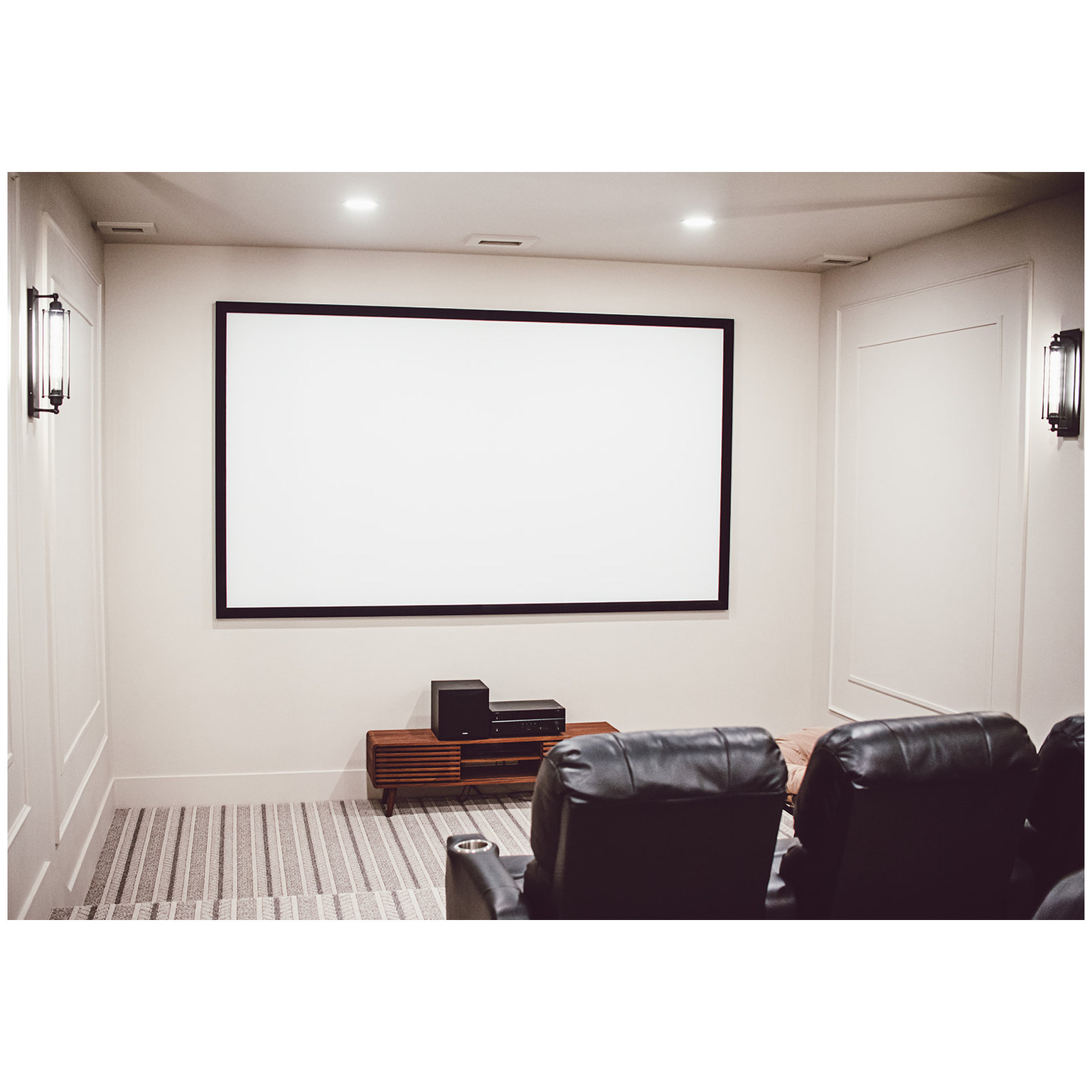 Home theater featuring carpet, baseboards, and recessed lighting