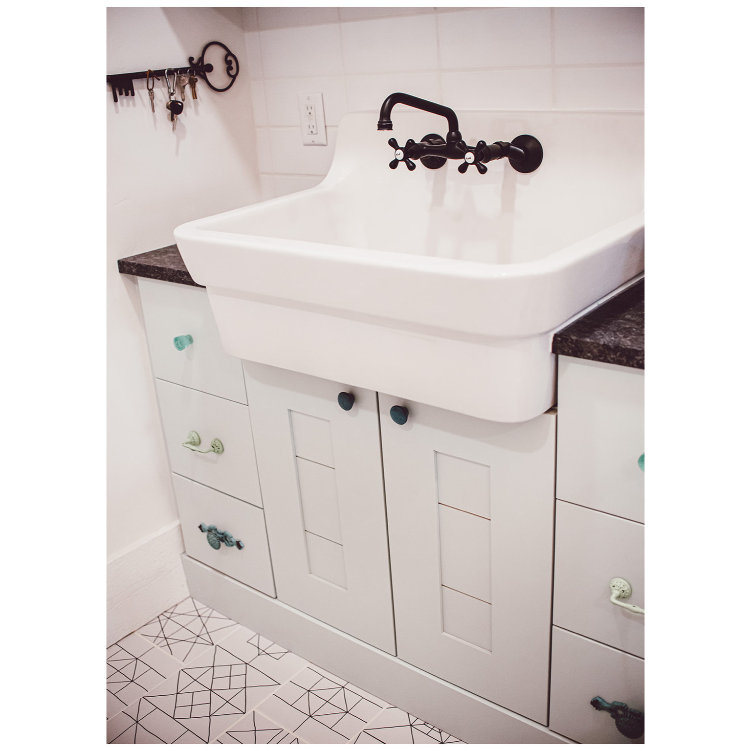 Bathroom with a sink and tile patterned floors