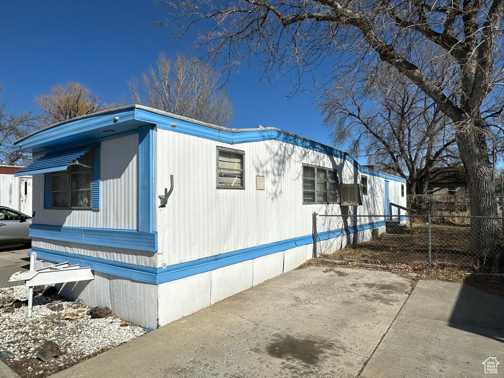 View of home's exterior with fence