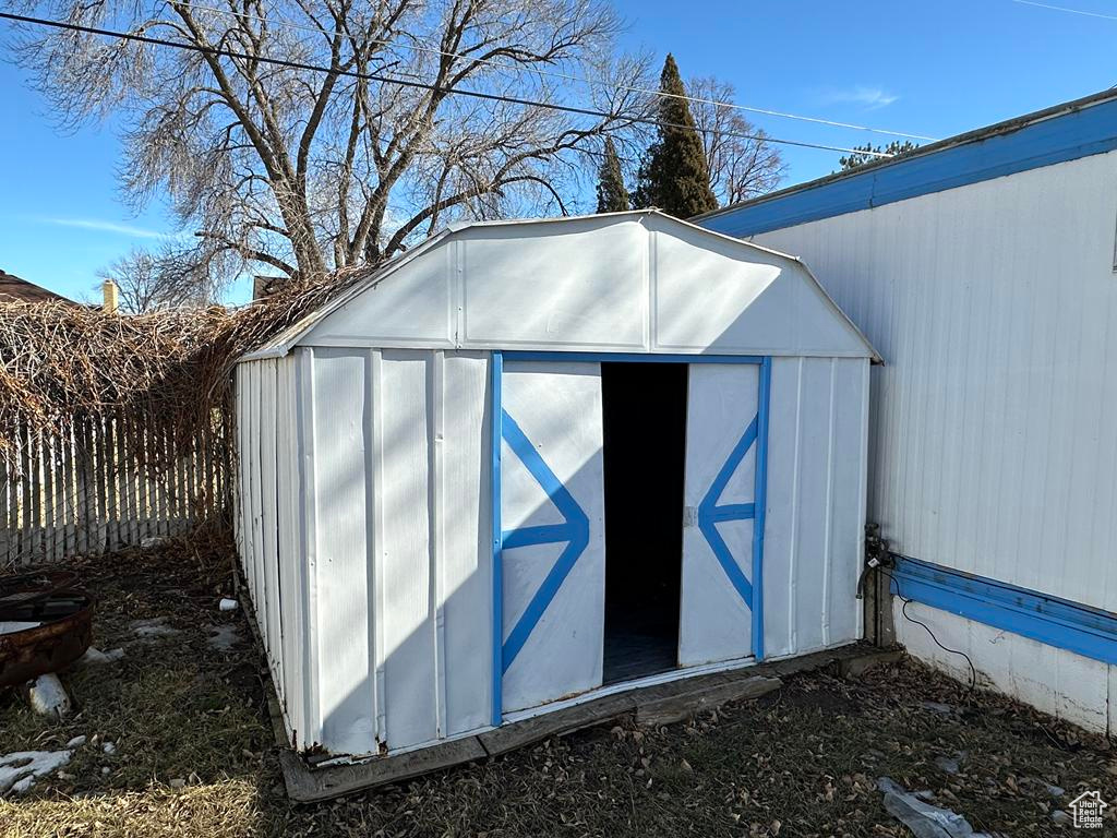 View of shed with fence