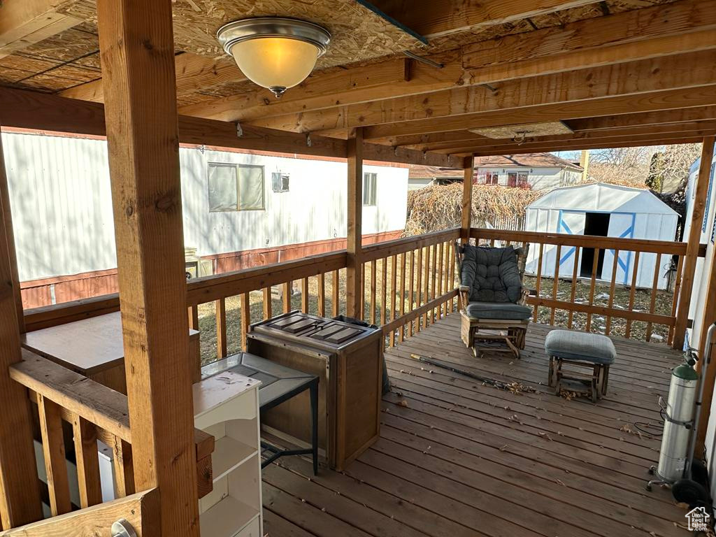 Deck featuring an outdoor structure