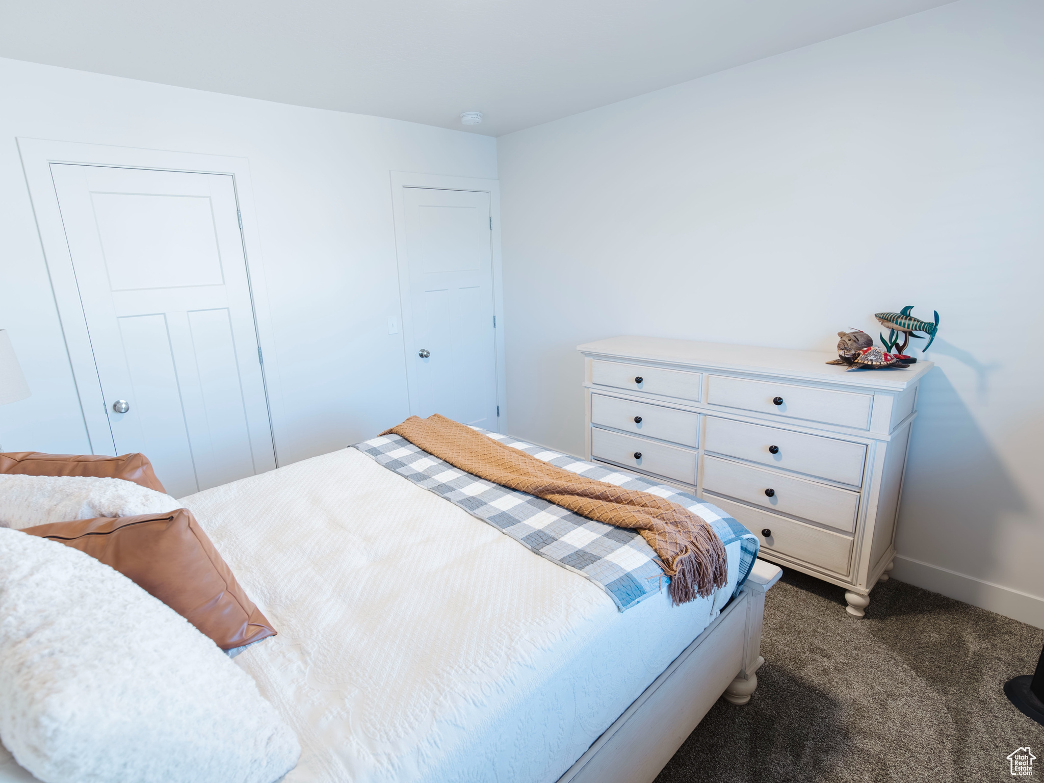 Carpeted bedroom with baseboards