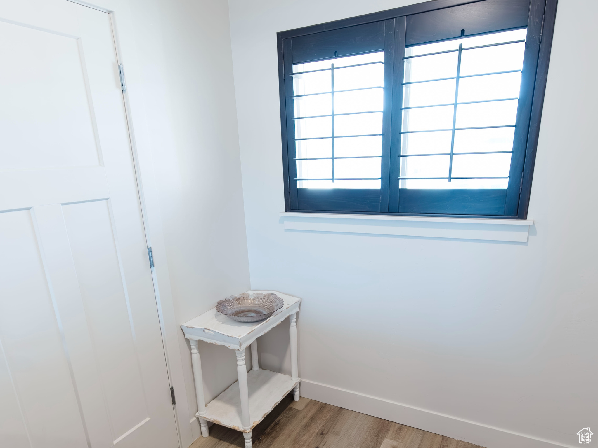 Unfurnished room featuring light wood-style flooring and baseboards