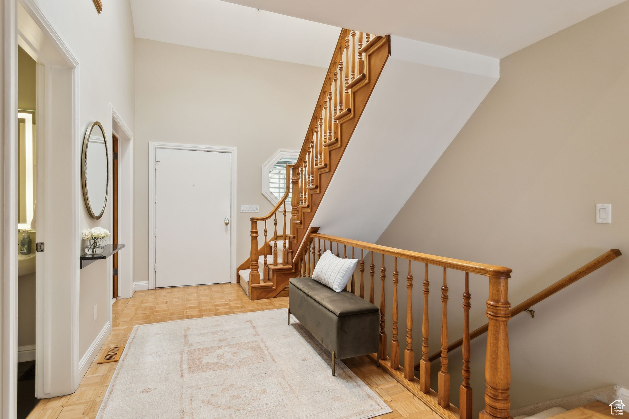 Entry with stairs to second level and basement