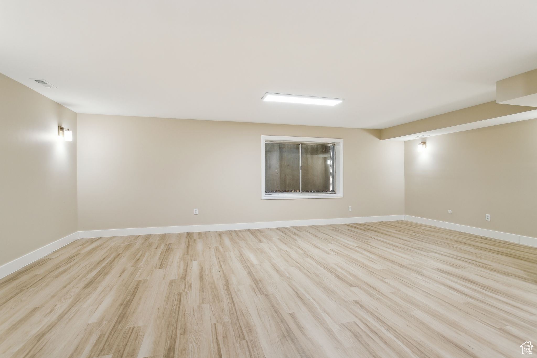 Fully finished basement with LVP flooring and 2-tone paint