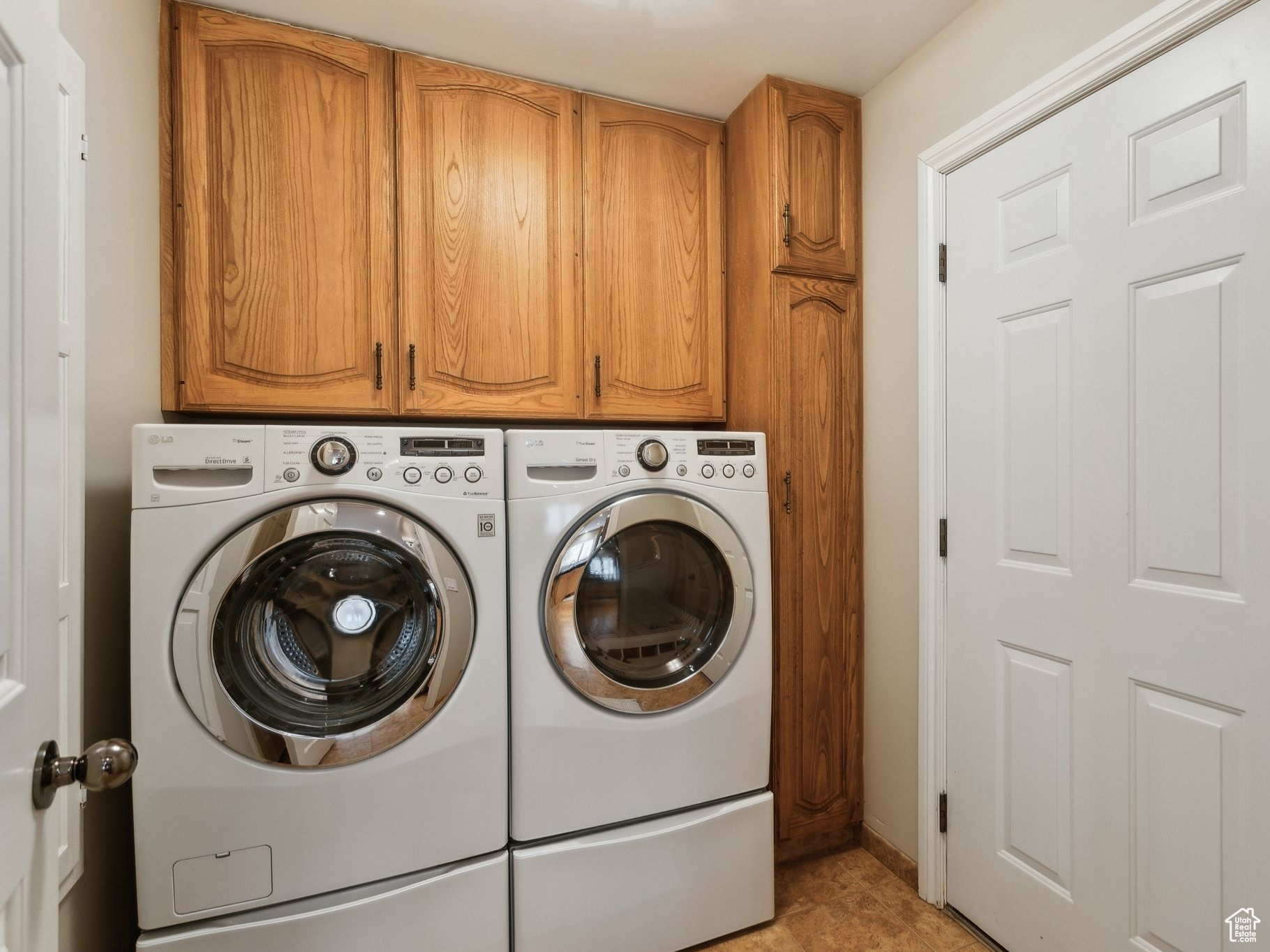 Laundry room off of kitchen.  Door to garage.