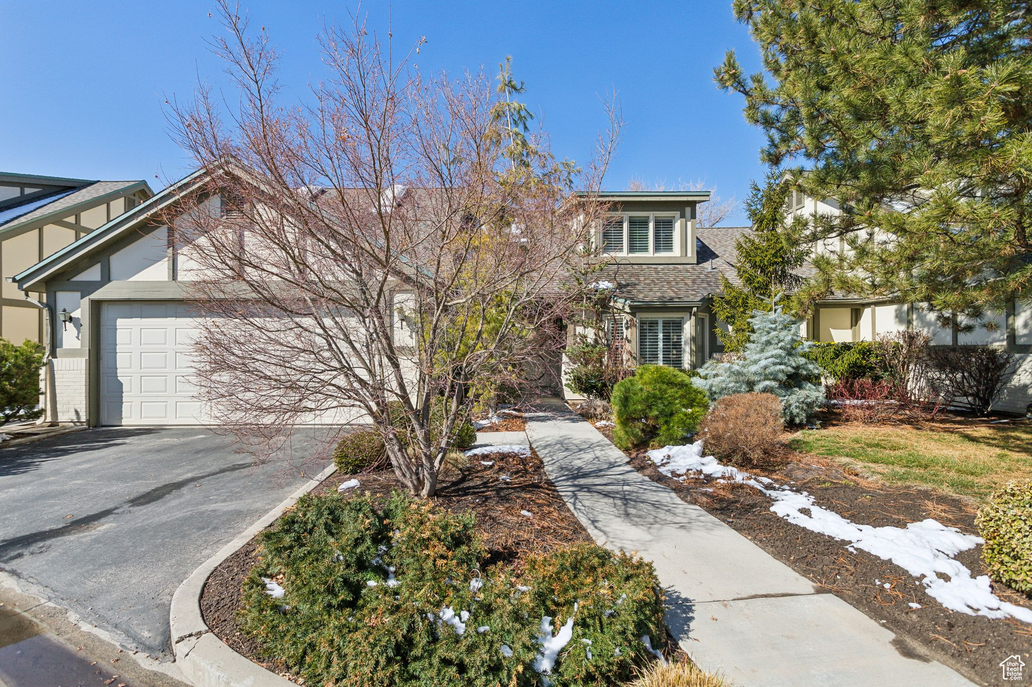 Inviting covered front porch & 2-car garage