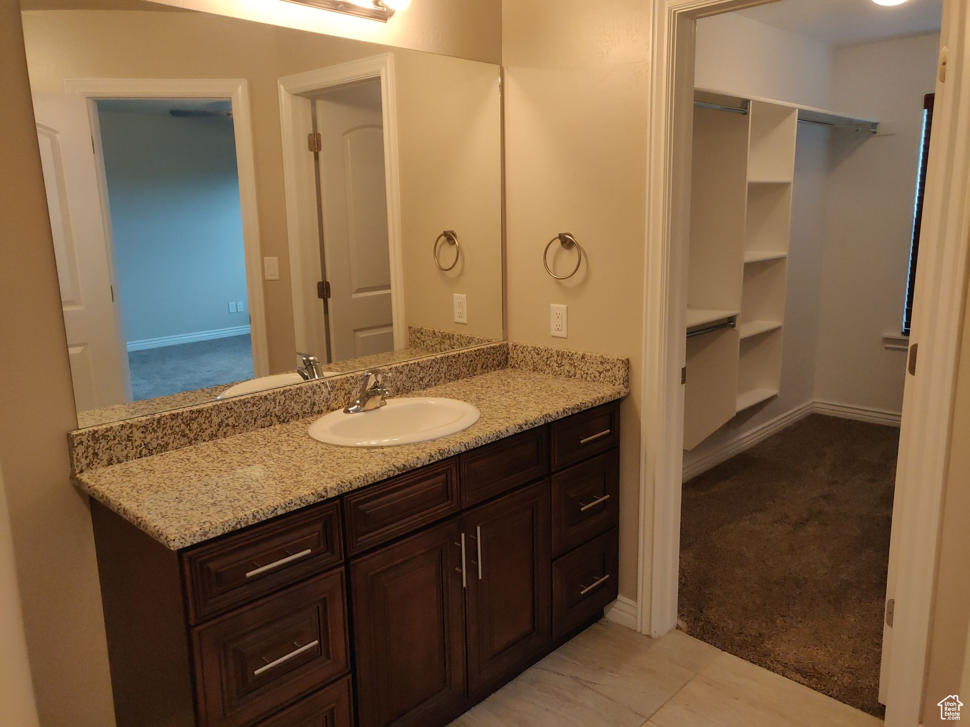 Bathroom with vanity and baseboards