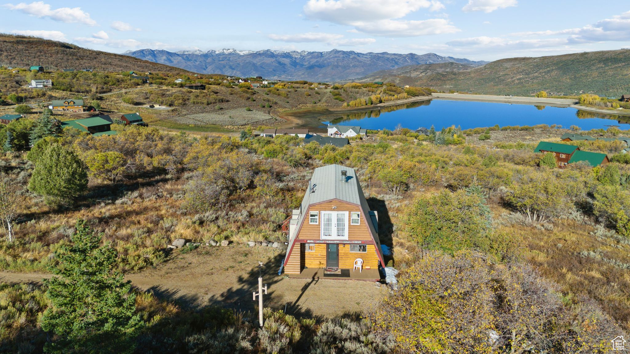 Aerial view featuring a water and mountain view