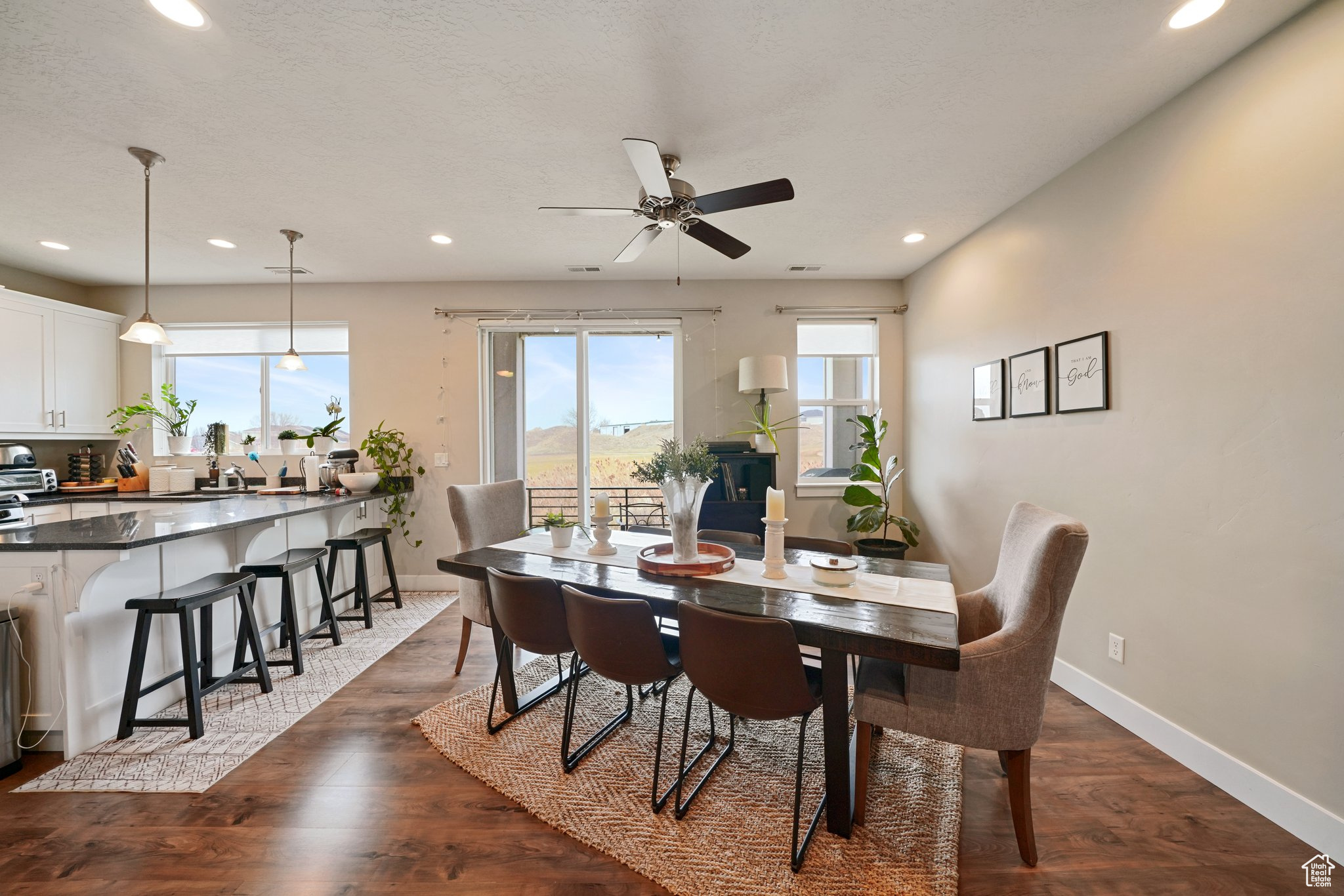 Dining room with recessed lighting, baseboards, ceiling fan, and dark wood-style flooring