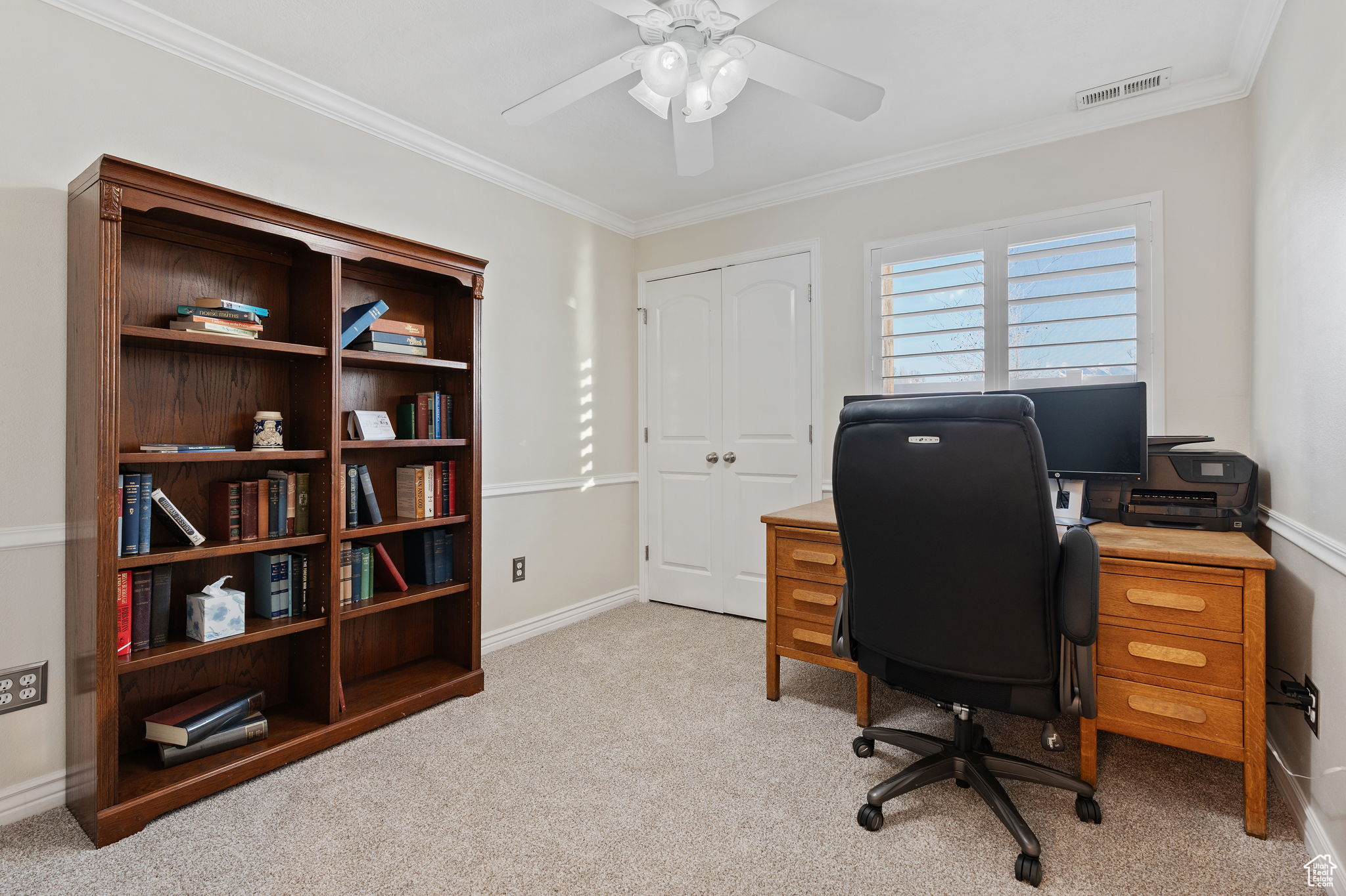 Main level bedroom featuring new carpet and new paint, doubles as an office, guest bedroom, game room, craft room, etc.