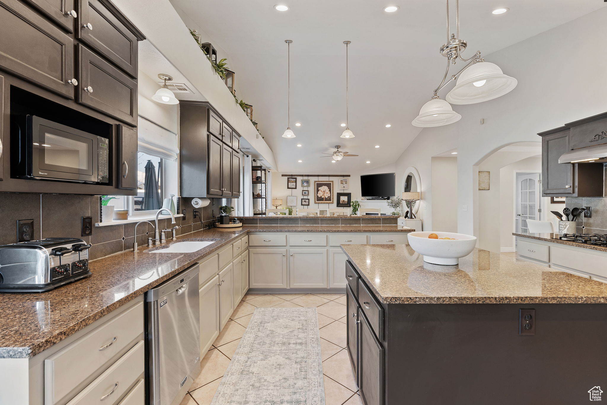 Gorgeous and spacious kitchen. Great for entertaining. Gas Stove. Double Oven. Can Lighting. High bar for informal eating. Island for prep and serving. Pantry. Abundant Cabinetry.