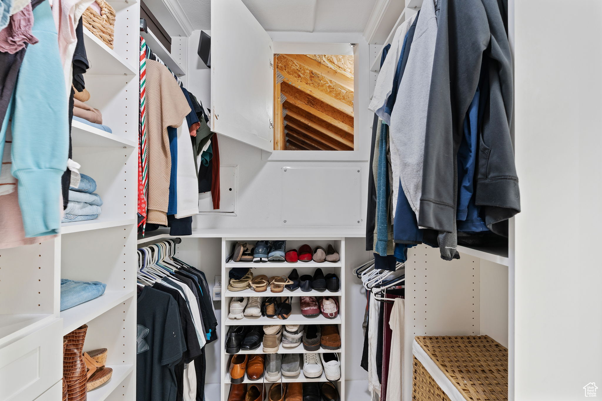 Walk in closet with access to attic storage!
