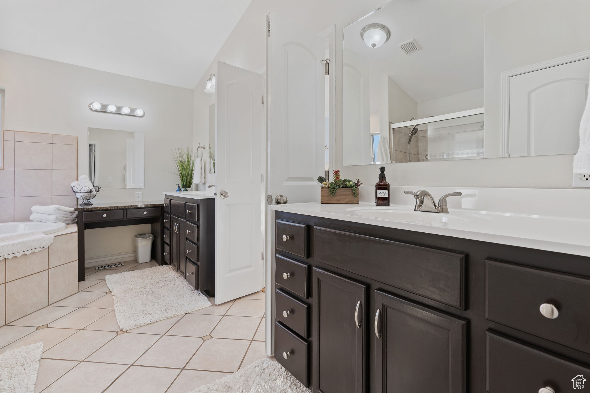 Primary Suite. Featuring separate tub, shower, his/her sinks.