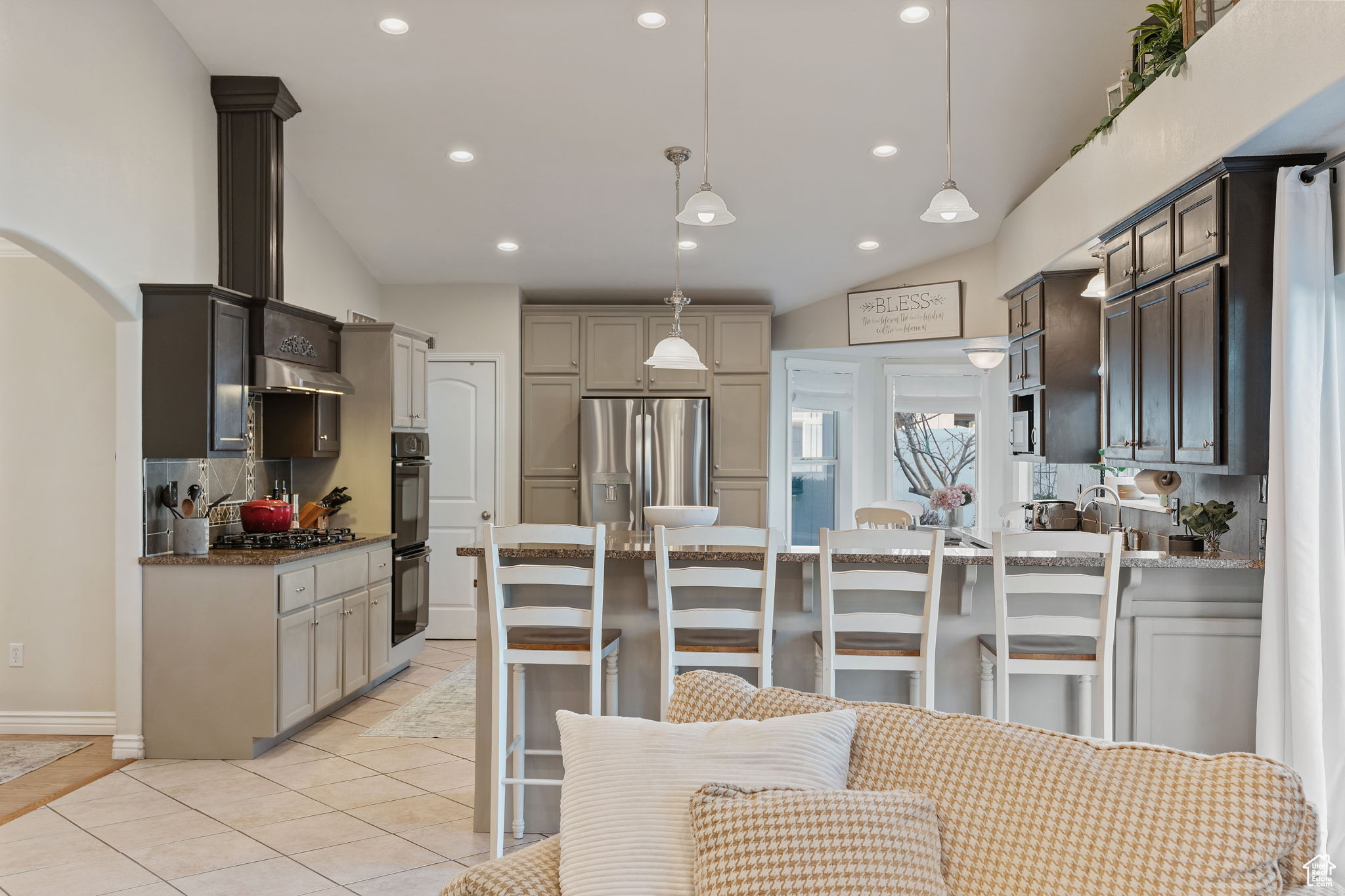 Gorgeous and spacious kitchen. Great for entertaining. Gas Stove. Double Oven. Can Lighting. High bar for informal eating. Island for prep and serving. Pantry. Abundant Cabinetry.