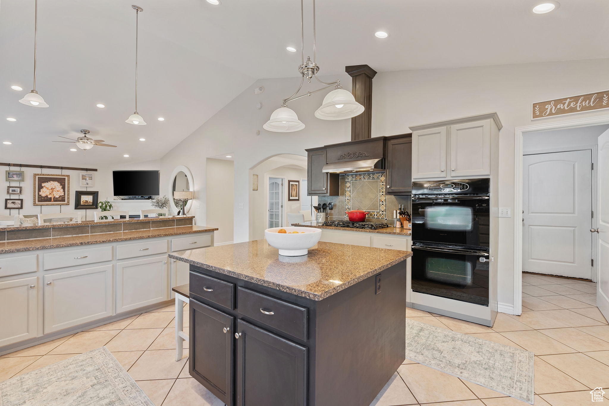 Gorgeous and spacious kitchen. Great for entertaining. Gas Stove. Double Oven. Can Lighting. High bar for informal eating. Island for prep and serving. Pantry. Abundant Cabinetry.